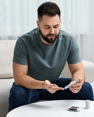 Man checking blood sugar